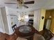 Cozy eat-in kitchen with white cabinets, stainless steel appliances, and a round dining table at 415 Dublin Ave, Bradenton, FL 34207