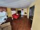 Inviting living room with wood flooring, a comfortable sofa, and lots of natural light at 415 Dublin Ave, Bradenton, FL 34207