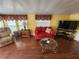 Bright and cozy living room, complete with wood-look flooring and great natural light at 415 Dublin Ave, Bradenton, FL 34207