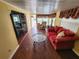 Comfortable living room with natural light, a comfortable sofa, and wood-look flooring at 415 Dublin Ave, Bradenton, FL 34207