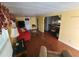 Bright living room featuring wood floors and easy access to the dining room and kitchen at 415 Dublin Ave, Bradenton, FL 34207