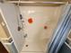 Bathroom shower with detachable shower head and built in shelving at 415 Dublin Ave, Bradenton, FL 34207