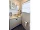 Bathroom featuring a shower/tub combo, sink, cabinet, and medicine cabinet at 415 Oakwood E Blvd, Sarasota, FL 34237