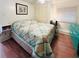 Well-lit bedroom boasts a cozy bed, closet, and decorative lamps at 415 Oakwood E Blvd, Sarasota, FL 34237