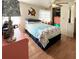 Bright bedroom featuring a comfortable bed, ceiling fan, and closet space at 415 Oakwood E Blvd, Sarasota, FL 34237