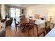 Well-lit dining room with an antique wood table and decoratively-lit sideboard at 415 Oakwood E Blvd, Sarasota, FL 34237