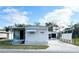 Charming single-story home with a well-maintained front yard and long driveway at 415 Oakwood E Blvd, Sarasota, FL 34237