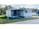 Charming single-story home with a well-maintained front yard and covered entry at 415 Oakwood E Blvd, Sarasota, FL 34237