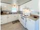 Charming kitchen featuring white cabinets, and updated appliances at 415 Oakwood E Blvd, Sarasota, FL 34237