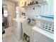 Laundry area with updated appliances and extra storage at 415 Oakwood E Blvd, Sarasota, FL 34237