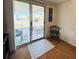 View of patio through sliding glass doors, featuring outdoor seating at 415 Oakwood E Blvd, Sarasota, FL 34237
