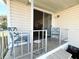 Inviting outdoor space with comfortable seating and a view into the home at 415 Oakwood E Blvd, Sarasota, FL 34237