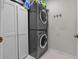 Laundry room with stackable washer and dryer and ample storage at 4805 52Nd W Ave, Bradenton, FL 34210