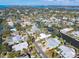 Wide aerial perspective of a waterfront community with winding canals, docks, and nearby ocean views at 5073 Higel Ave, Sarasota, FL 34242