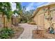 Backyard brick pathway alongside home at 5073 Higel Ave, Sarasota, FL 34242