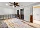 Bedroom, gutted, prepped for renovation with closet and doorway at 5073 Higel Ave, Sarasota, FL 34242