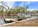 Boat on a lift at a private dock, with canal view at 5073 Higel Ave, Sarasota, FL 34242