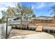 Boat on a lift at a private dock, with screened lanai in the background at 5073 Higel Ave, Sarasota, FL 34242