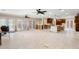 Bright open concept kitchen, dining, and living room featuring tile flooring at 5073 Higel Ave, Sarasota, FL 34242