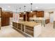 Open kitchen layout showcasing a large island and custom cabinetry needing renovation at 5073 Higel Ave, Sarasota, FL 34242
