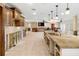 Open-concept kitchen featuring a large island that needs renovation and custom cabinetry at 5073 Higel Ave, Sarasota, FL 34242