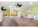 Spacious living room with updated ceiling fan and access to outdoor area at 5073 Higel Ave, Sarasota, FL 34242