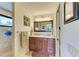 Elegant bathroom features a double sink vanity with granite countertop, ample storage and updated fixtures at 526 Loquat Dr, Anna Maria, FL 34216