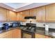 Detailed view of the kitchen showcasing modern appliances and granite countertops at 526 Loquat Dr, Anna Maria, FL 34216