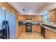 Functional kitchen featuring stainless steel appliances and ample cabinet space at 526 Loquat Dr, Anna Maria, FL 34216