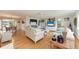 Bright living room with hardwood floors, cozy seating, and stylish decor for comfortable living at 526 Loquat Dr, Anna Maria, FL 34216
