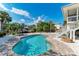 Beautiful pool area surrounded by lush greenery, offering a serene and private retreat at 526 Loquat Dr, Anna Maria, FL 34216