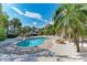 Outdoor pool surrounded by lush landscaping, perfect for relaxation and enjoyment at 526 Loquat Dr, Anna Maria, FL 34216