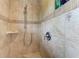 Tiled walk-in shower featuring modern fixtures and design; neutral color palette at 526 Loquat Dr, Anna Maria, FL 34216