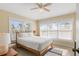 Inviting bedroom featuring a comfortable bed, plenty of natural light, and a ceiling fan for added comfort at 527 Magnolia Ave, Anna Maria, FL 34216