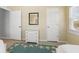 Bedroom featuring twin beds, starfish rug, and neutral walls at 527 Magnolia Ave, Anna Maria, FL 34216