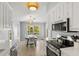 Bright kitchen offering stainless appliances and a view into the dining area at 527 Magnolia Ave, Anna Maria, FL 34216