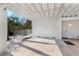 Spacious outdoor patio featuring brick flooring and ample space for seating, perfect for entertaining at 527 Magnolia Ave, Anna Maria, FL 34216