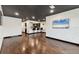 Open-concept living area with a bar and dark stained wood floors at 5312 11Th Street E Cir, Bradenton, FL 34203