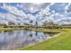 Scenic view of a community with a pond and lush landscaping at 5312 11Th Street E Cir, Bradenton, FL 34203