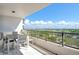 Balcony with city view, perfect for outdoor dining and relaxation at 535 Sanctuary Dr # B604, Longboat Key, FL 34228