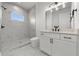 Modern bathroom featuring a marble shower and sleek vanity with modern fixtures at 597 Buttonwood Dr, Longboat Key, FL 34228