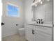 Modern bathroom featuring a vanity with sleek hardware and a stylish mirror at 597 Buttonwood Dr, Longboat Key, FL 34228