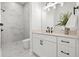 Modern bathroom featuring marble tile, a walk-in shower, and a white vanity with black fixtures at 597 Buttonwood Dr, Longboat Key, FL 34228