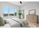 Bright bedroom offers a large window, accent rug, and modern decor at 597 Buttonwood Dr, Longboat Key, FL 34228