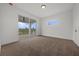 Bright bedroom with large sliding doors that open to a balcony with beautiful views at 597 Buttonwood Dr, Longboat Key, FL 34228