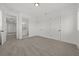 Spacious bedroom with neutral carpet, white walls, and ample natural light at 597 Buttonwood Dr, Longboat Key, FL 34228