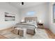 Bright bedroom offers a large window, accent rug, and modern decor at 597 Buttonwood Dr, Longboat Key, FL 34228