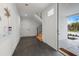 Bright entryway with tiled flooring, a modern door, and stairway access at 597 Buttonwood Dr, Longboat Key, FL 34228