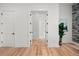 Hallway with hardwood floors and white doors at 597 Buttonwood Dr, Longboat Key, FL 34228