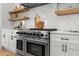 Close up of the stove and marble backsplash in the gourmet kitchen at 597 Buttonwood Dr, Longboat Key, FL 34228